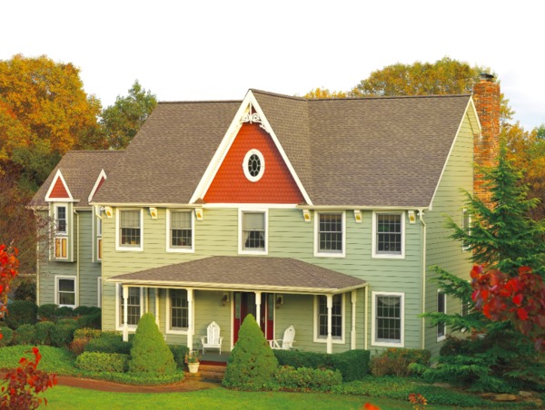 Home with front porch and white trim.